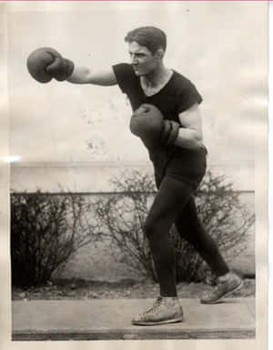 Pete Latzo Throws A Punch In The Air Wallpaper