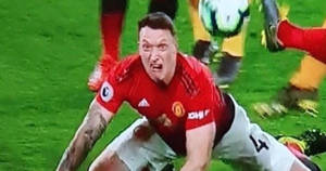 Phil Jones In Action On The Football Field Wallpaper