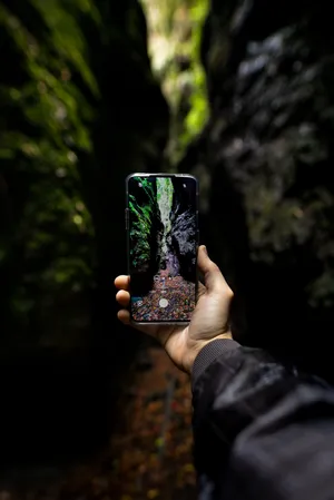 Phone Between Rocks Wallpaper