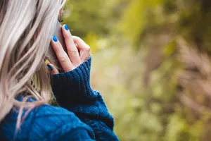 Phone Call Woman With Blue Sweater Wallpaper