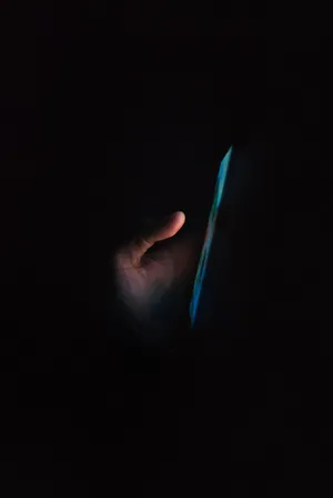 Phone In Dark Wallpaper