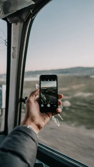 Phone In Window Wallpaper