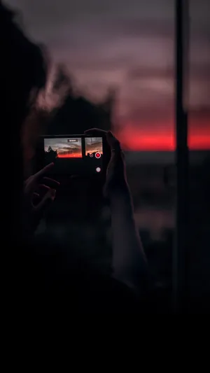 Phone Taking Sunset Wallpaper
