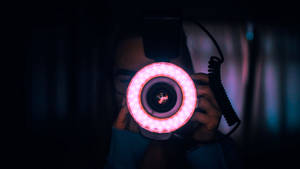 Photographer With Pink Ring Light Wallpaper