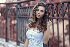 Photoshoot Of A Woman With Brown Curls Wallpaper