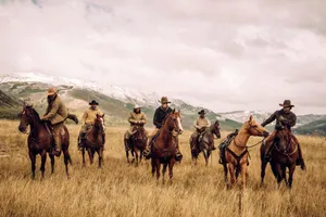 Picture Perfect Scenery Of A Ranch Near The Mountains Wallpaper