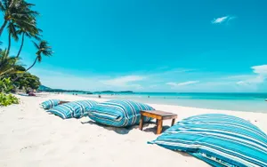 Pillows On White Beach Wallpaper
