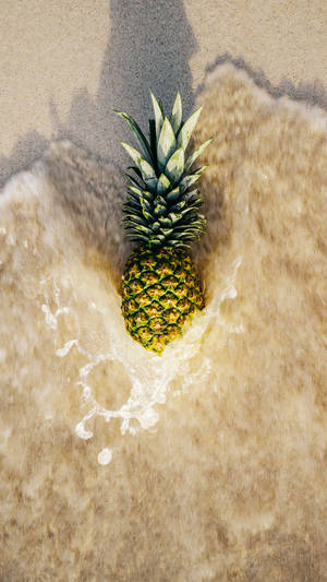 Pineapple In Beach Waves Wallpaper