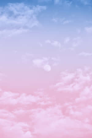 Pink And Blue Clouds With A Moon In The Sky Wallpaper