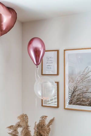 Pink Balloons And Frames At Bachelorette Party Wallpaper