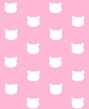 Pink Cat Sitting Near A Table Wallpaper