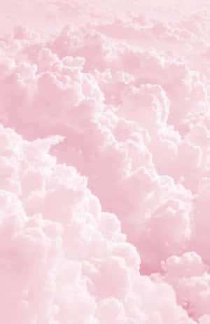 Pink Clouds In The Sky With A Pink Background Wallpaper