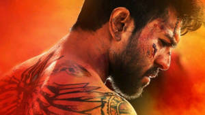 Pioneering Actor Ram Charan In High Definition Showcasing His Impressive Back Tattoos. Wallpaper