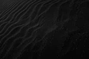 Plain Black Desktop With Sand Ridges Wallpaper