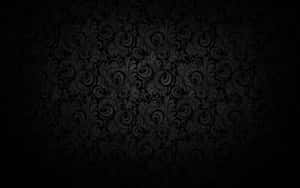 Plain Black Desktop With Swirling Leaves Wallpaper