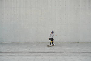 Plain Grey Woman Skateboarding Wallpaper