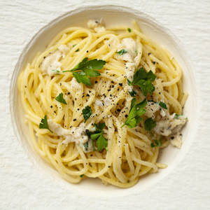 Plate Of Cacio E Pepe With Basil Wallpaper