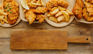 Plates And Trays Of Fish And Chips Wallpaper