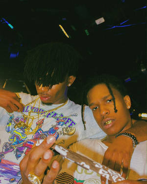Playboi Carti And A$ap Rocky Standing Side-by-side Wallpaper