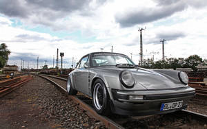 Porsche 911 On Train Tracks Wallpaper