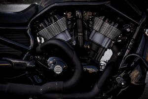 Power Up Your World With A Sleek, Black And Gray Motorcycle Engine. Wallpaper