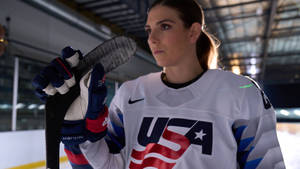 Powerful And Passionate, Usa's Alternate Captain Hilary Knight In Action Wallpaper