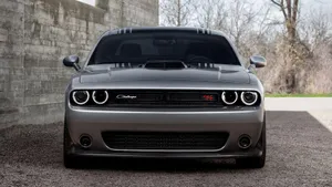 Powerful Dodge Challenger Showcasing Its Sleek Design And Narrow Hood Scoop Wallpaper
