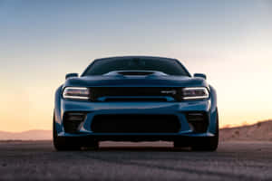 Powerful Dodge Charger Cruising Down The Highway Wallpaper