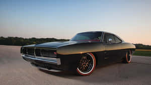 Powerful Dodge Charger In Action Wallpaper