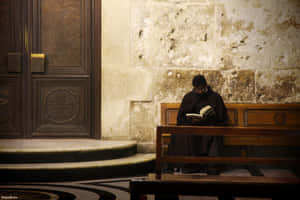 Praying At The Catholic Church Wallpaper