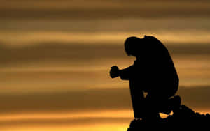 Praying Down In Sadness Wallpaper