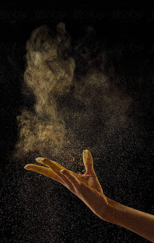 Precious Gold Dust In Hand Wallpaper