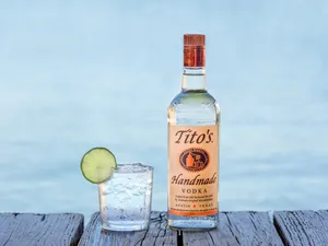 Premium Tito's Vodka Served With A Fresh Lime Slice Wallpaper