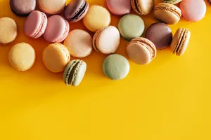 Pretty Pastel Macarons Yellow Backdrop Wallpaper
