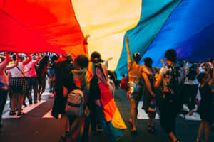 Pride Desktop People With Big Rainbow Flag Wallpaper