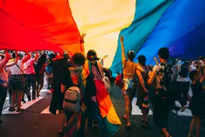 Pride Desktop People With Big Rainbow Flag Wallpaper