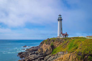 Pristine White Lighthouse Wallpaper