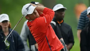 Pro Golfer Jb Holmes In Orange Wallpaper