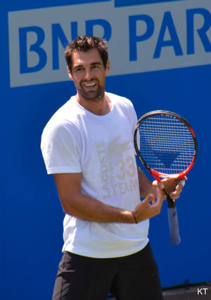 Pro Tennis Player Jeremy Chardy Acing A Match In A White Shirt Wallpaper