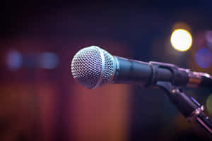 Professional Dynamic Microphone Under The Spotlight Wallpaper