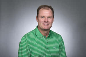 Professional Golferin Green Striped Shirt Wallpaper