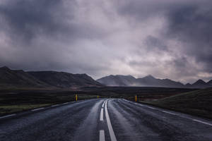 Professional Stormy Country Road Wallpaper