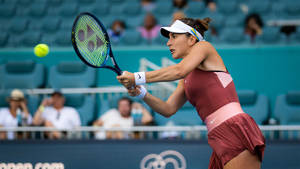 Professional Tennis Player Belinda Bencic In Action Wallpaper