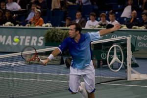 Professional Tennis Player Radek Stepanek Preparing To Return Serve Wallpaper