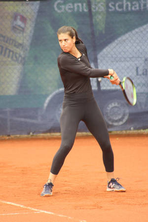 Professional Tennis Player Sorana Cirstea In Action Wallpaper