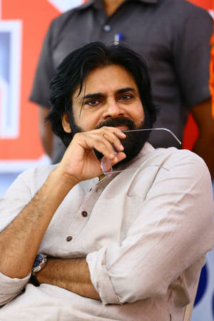 Pspk Pondering With Spectacles In Hand Wallpaper