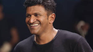 Puneeth Rajkumar Smiling Wallpaper