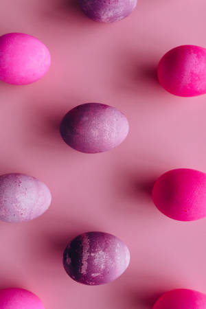Purple Eggs On Pink Background Wallpaper