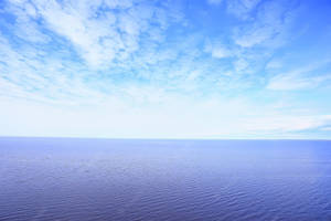 Purple Sea And Blue Sky Horizon Wallpaper