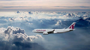 Qatar Airways Amidst A Cloudy Sky Wallpaper